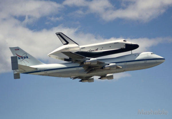 Shuttle Enterprise flys above New York City aboard a Boeing 747