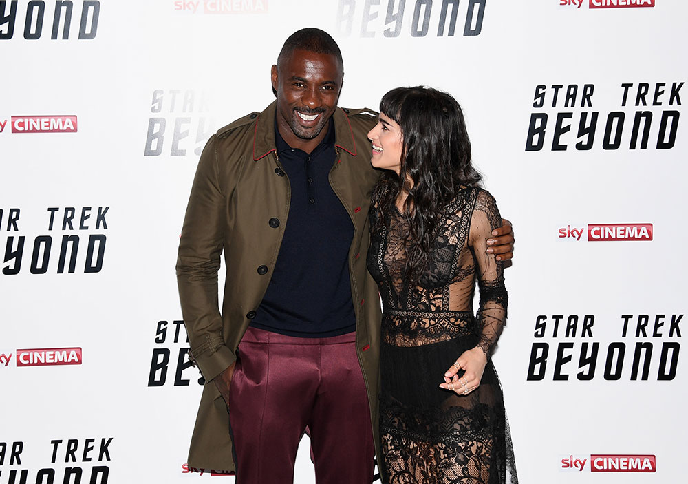 Idris Elba and Sofia Boutella stare a laugh