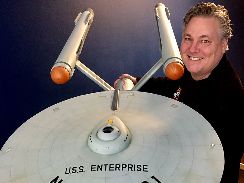 Burnett holding the Enterprise