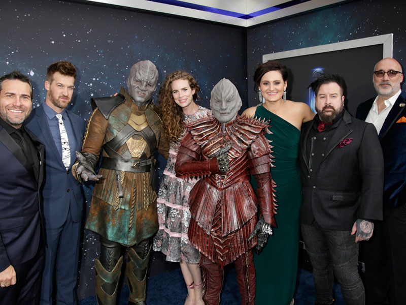 Members of the Star Trek: Discovery cast and crew with Klingons