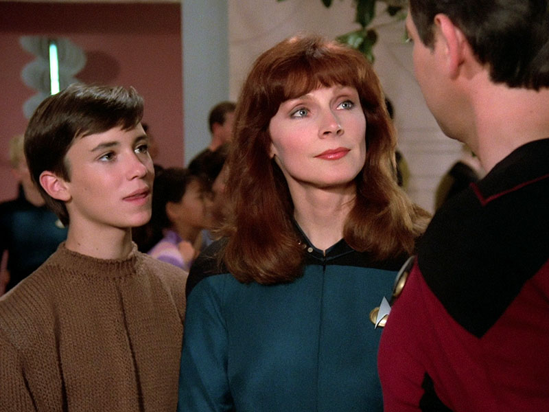Wil Wheaton as Wesley Crusher, Gates McFadden as Beverly Crusher and Jonathan Frakes as William Riker